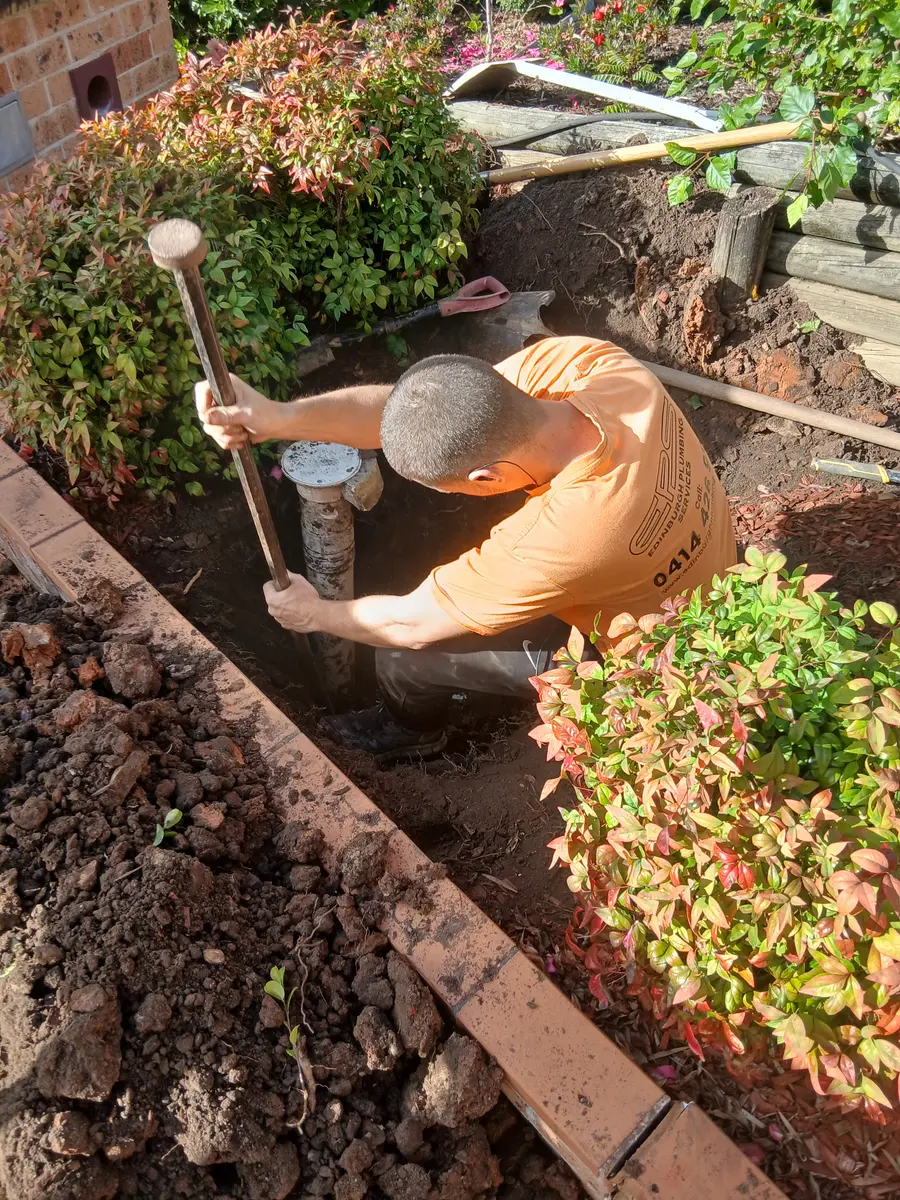 Excavated underground pipework exposed in a trench for repair